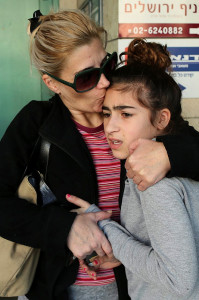 A mother and child react to missile warning siren. (Photo: Nati Shohat/Flash 90) 