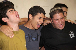 Mourners gather around the home of terror victim Eyal Yifrach, 19. (Photo: Flash90)
