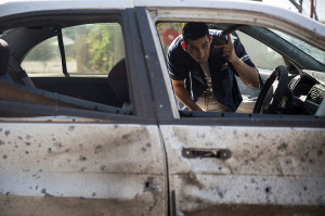 This man's car was hit by a rocket near Sderot. (Photo: Hadas Parush/ Flash90)