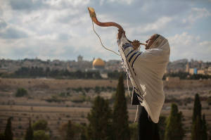 A man blows a shofar on the Mount of Olives. (Photo: Yonatan Sindel/Flash90
)