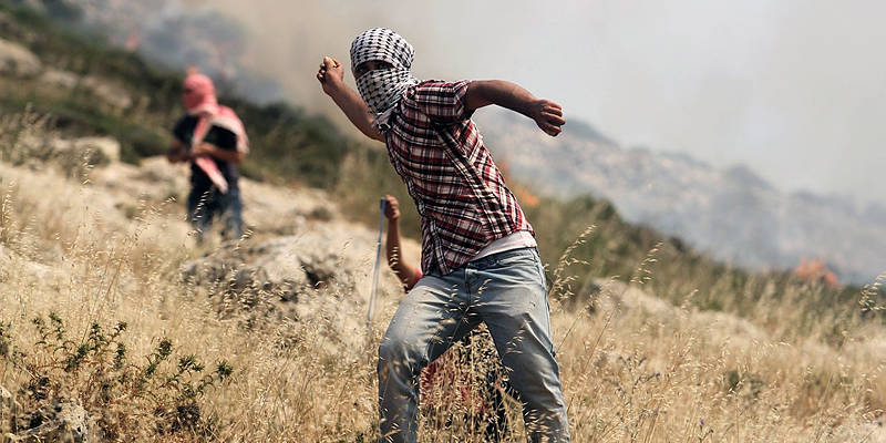 Palestinians attack with rocks.