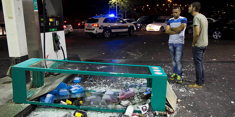 A gas station heavily damaged by Arab rioters