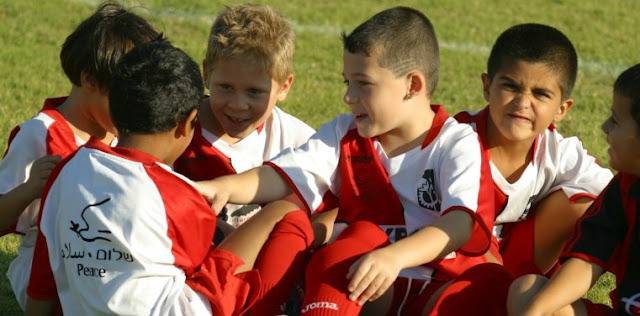 Israeli and Paletinian children meet for a soccer match sponsored by the Peres Center for Peace