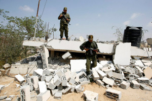 Hamas inspect their headquarters destroyed by the IDF during Operation Protective Edge. (Photo: Abed Rahim Khatib/Flash90)