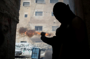 An Arab terrorist shoots firecrackers at an Israeli target. (Photo: Hadas Parush/ Flash90) 