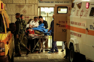 One of the soldiers wounded in the terror attack treated at the entrance to Haddasah Hospital. (Photo: Hadas Parush/Flash90)