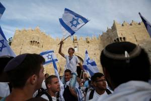 Waving Israeli flag in Old City, Jerusalem