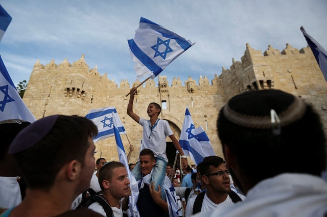 Waving Israeli flag in Old City, Jerusalem