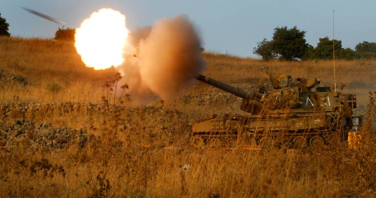 An Israeli mobile artillery piece fires a shell. (Olivier Fitoussi/Flash 90)