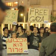 Israeli left wing activists holding placards during a demonstration. (Photo by Yossi Aloni/Flash90)