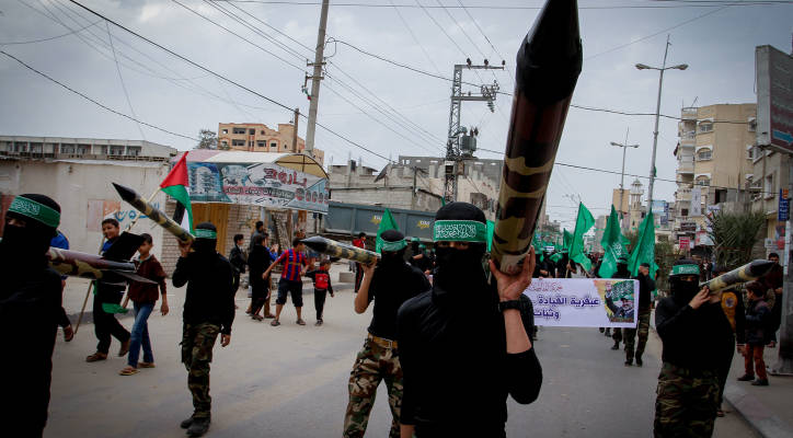 Masked terrorists march in a rally