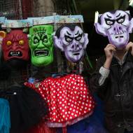 An Israeli man offers costumes before the upcoming Jewish holiday of Purim. (Nati Shohat/Flash 90)