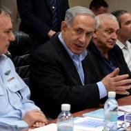 Israeli Prime Minister Benjamin Netanyahu (C), Chief of Police Yohanan Danino (L), and Minister of Internal Security Yitzhak Aharonovitch seen during a meeting on the storm which is expected to hit Israel later this afternoon, at the Ministry of Public Security in Lod, on February 19, 2015. photo by Haim Zach / GPO