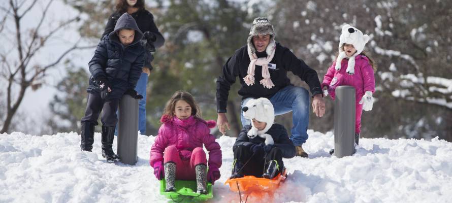 Kids sliding in Jerusalem's Independence Park. (Yonatan Sindel/Flash90)