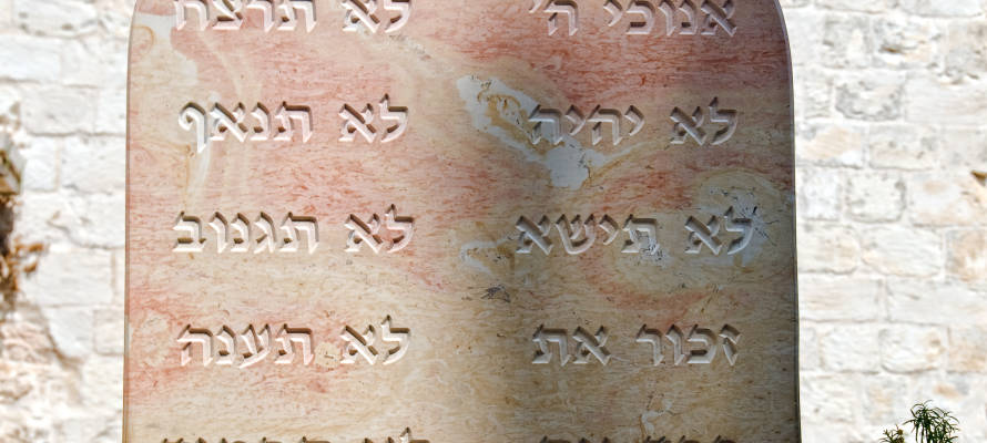 Marble with abbreviated phrases alluding to the Ten commandments. (Yuriy Chertok/Shutterstock)