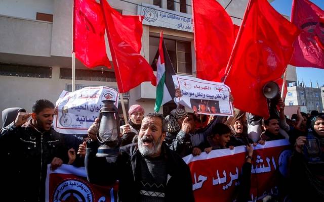 Palestinians take part in a protest against the power crisis in Gaza,