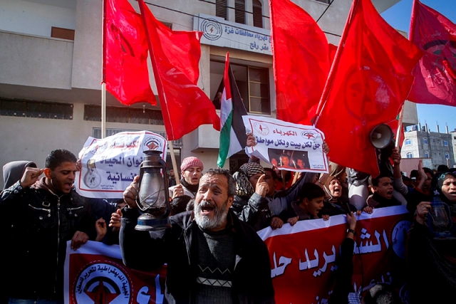 Palestinians take part in a protest against the power crisis in Gaza,