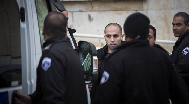 Rami Alami (2L) An Arab attorney from east Jerusalem seen surrounded by guards after a court hearing in the Magistrate's Court in Jerusalem on March 12, 2015. (Yonatan Sindel/Flash90)
