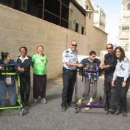 ALEH children with Israel Police officers prepare for the Jerusalem Marathon. (Courtesy)