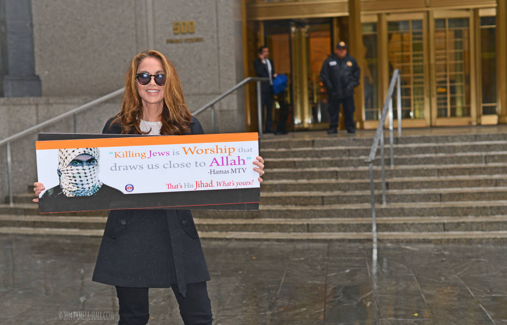 Pamela Geller holds the anti-Hamas ad.