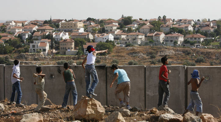 Palestinian youth throw rocks