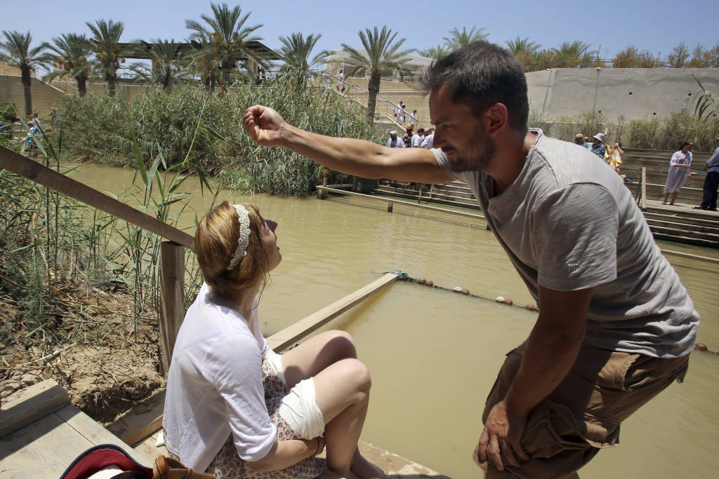 Christian baptisms on both sides of the Jordan River