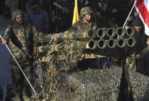 Hezbollah terrorists with a rocket launcher. (AP/Mohammed Zaatari)