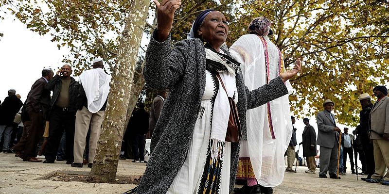 Thousands of Ethiopian Jews take part in a prayer of the Sigd holiday on the Armon Hanatziv Promenade overlooking Jerusalem on November 30, 2016.