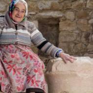 Margalit Zinati of Pekiʽin village, and the ancient stone