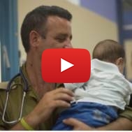 IDF soldier and Syrian child