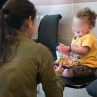 IDF soldier and Syrian child (IDF)