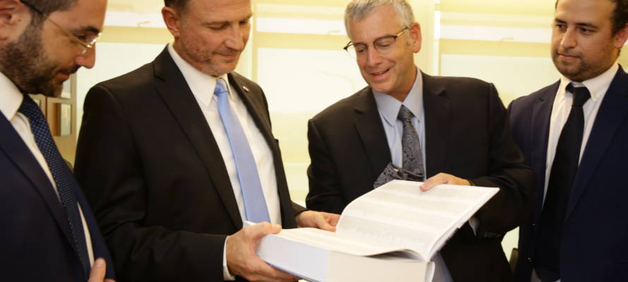 Knesset Speaker Yuli Edelstein and UWi staff display the Jerusalem Declaration