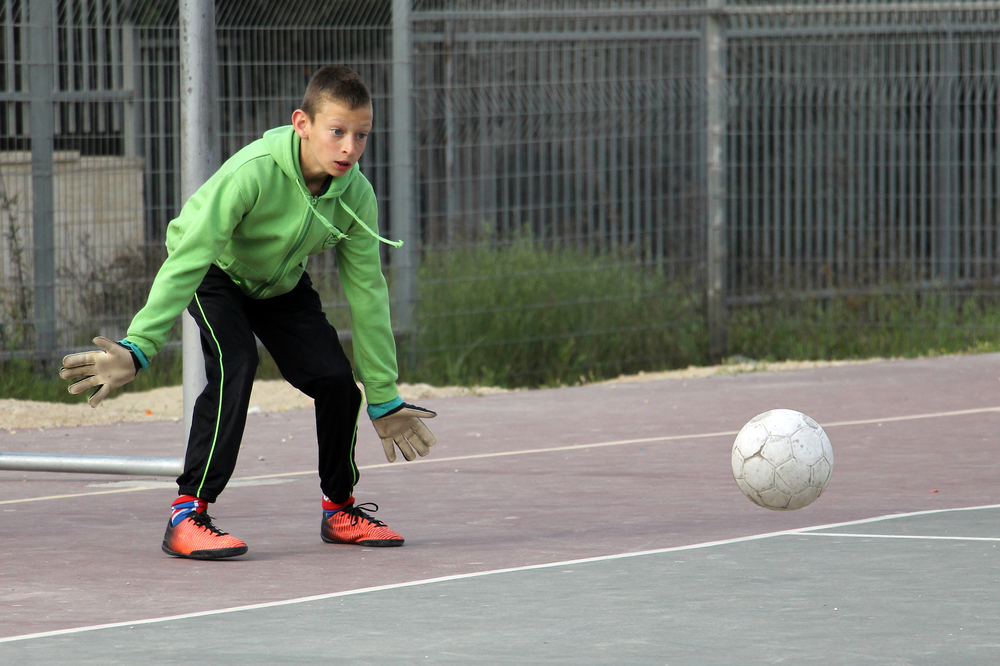 Israeli child plays football