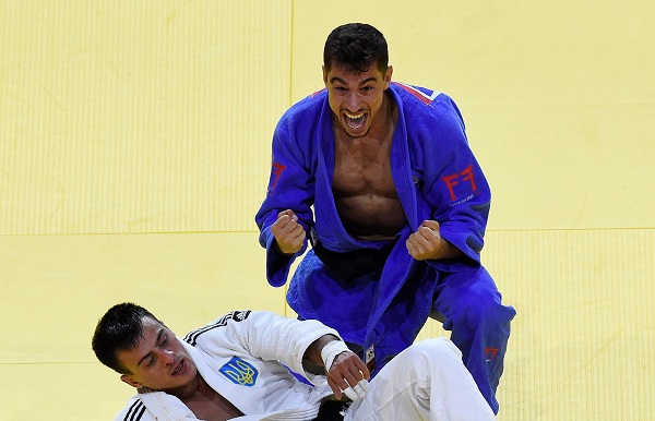 Tal Flicker of Israel, in blue. (Tamas Kovacs/MTI via AP)