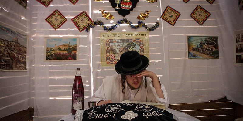 Man in sukkah