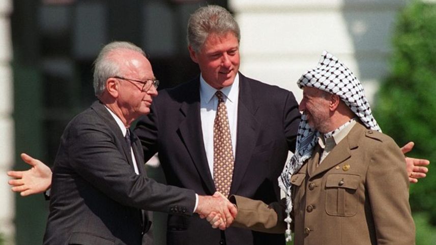 Israeli Prime Minister Yitzchak Rabin shakes hands with arch-terrorist Yasser Arafat at the Oslo Accords signing. (AP)