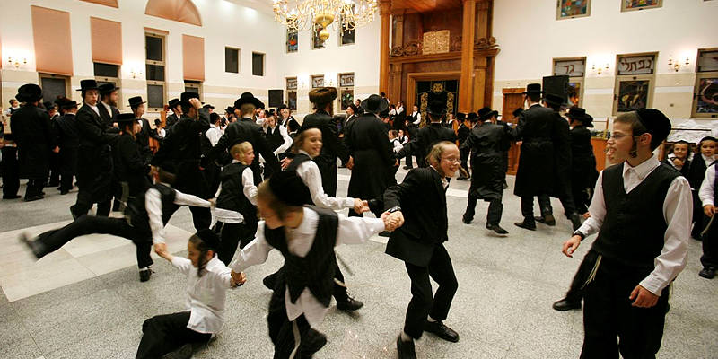 Men and boys dancing on Sukkot