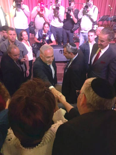 PM Netanyahu greets United with Israel founder Michael Gerbitz at media conference in Jerusalem (Photo: UWI)