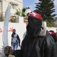 A supporter of the PFLP terrorist organization, whose flag flew in London. (AP Photo/Adel Hana)