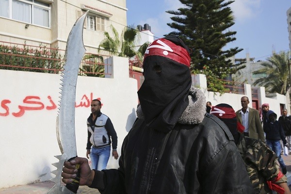 A supporter of the PFLP terrorist organization, whose flag flew in London. (AP Photo/Adel Hana)