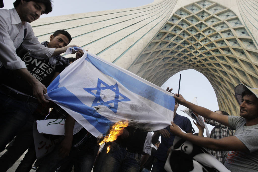 Iranians burn an Israeli flag. (AP Photo/Vahid Salemi)