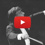 In this Sept. 24, 1962 file photo Leonard Bernstein leads the New York Philharmonic Orchestra in the inaugural concert in New York's new Philharmonic Hall.