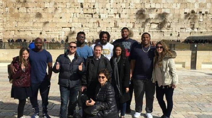 NFL football players at the Western Wall