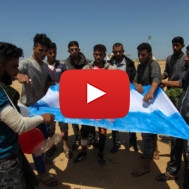 Palestinians burn an Israeli flag near the Gaza border. (Abed Rahim Khatib/Flash90)