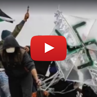 Palestinian rioters in Gaza with a swastika-adorned arson. (screenshot)