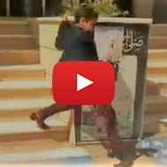 Iranian child refuses to step on Israeli and US flags. (Screenshot)