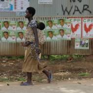 A woman walks on a street in Accra, Ghana