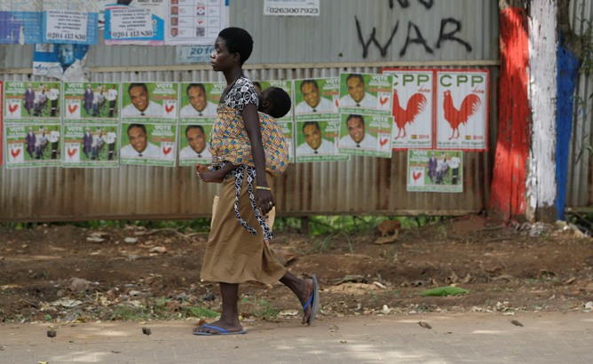 A woman walks on a street in Accra, Ghana