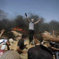 Palestinians setting fires during violent riots in the Gaza Strip. (AP Photo/Adel Hana)