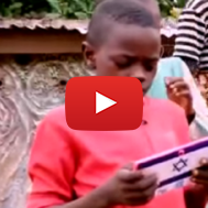 A Nigerian boy uses the tablet he was given through an Israeli program